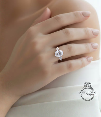 A close-up of a person's hand wearing a large, sparkling diamond engagement ring.
