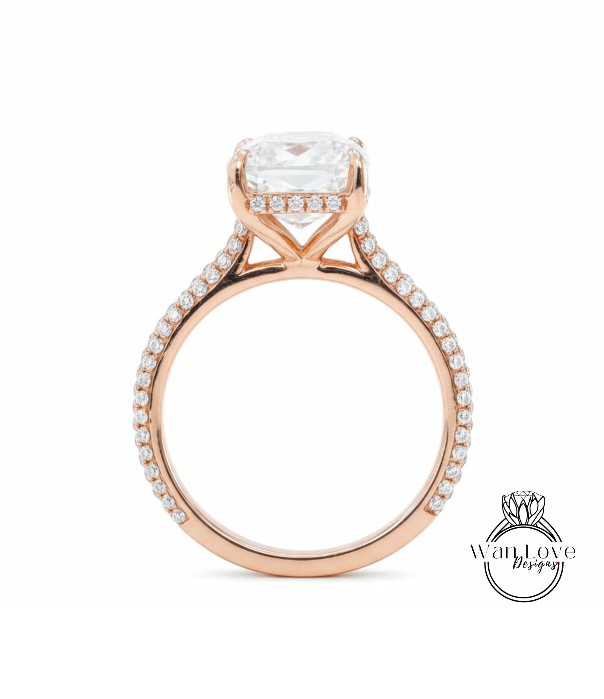 A beautiful rose gold engagement ring with a large, clear gemstone set in the center.