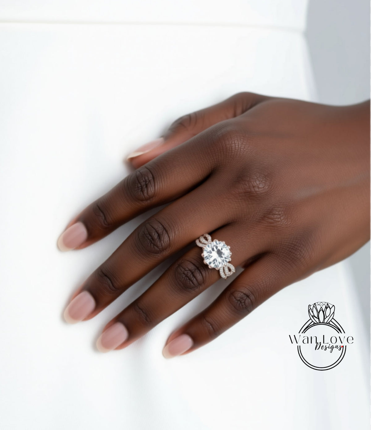A close-up of a hand wearing a large diamond engagement ring.