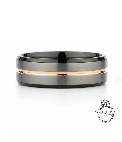 A silver and black ring with a thin gold stripe.