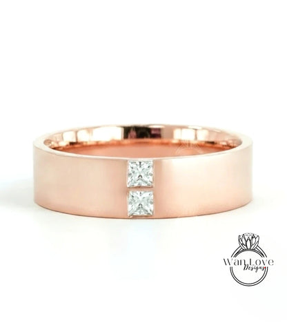 A rose gold ring with a large diamond set in the center.