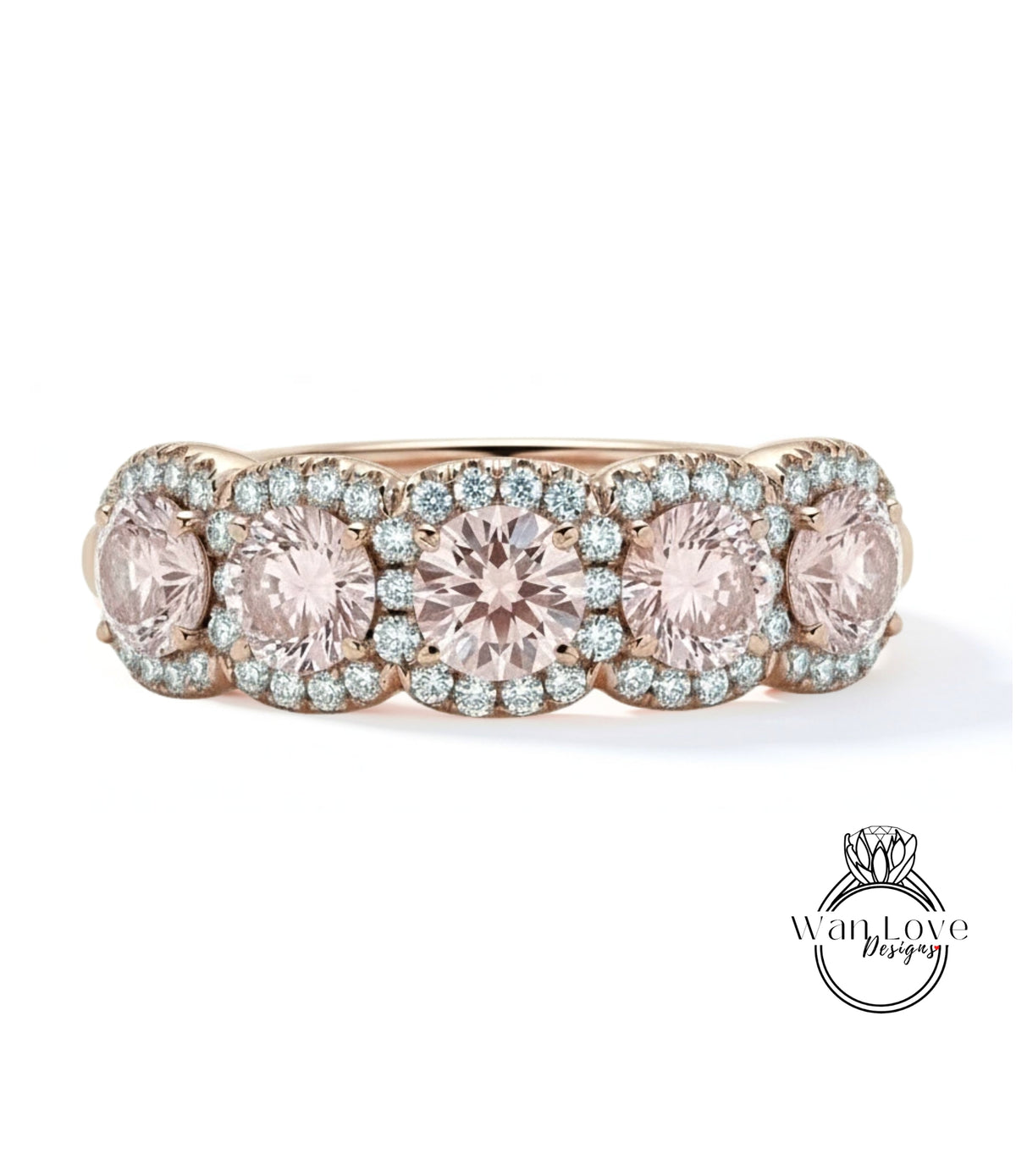 A gold ring with a row of pink diamonds set in the center, showcasing a beautiful and elegant design.