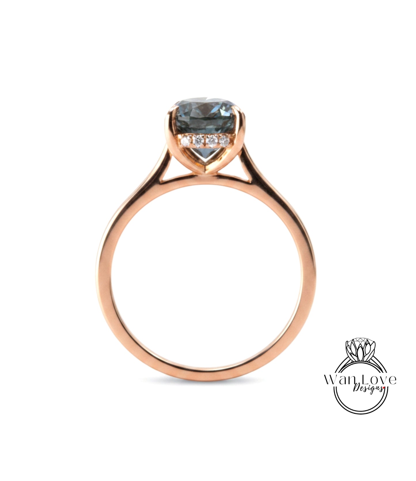 A rose gold engagement ring with a large blue gemstone set in the center.
