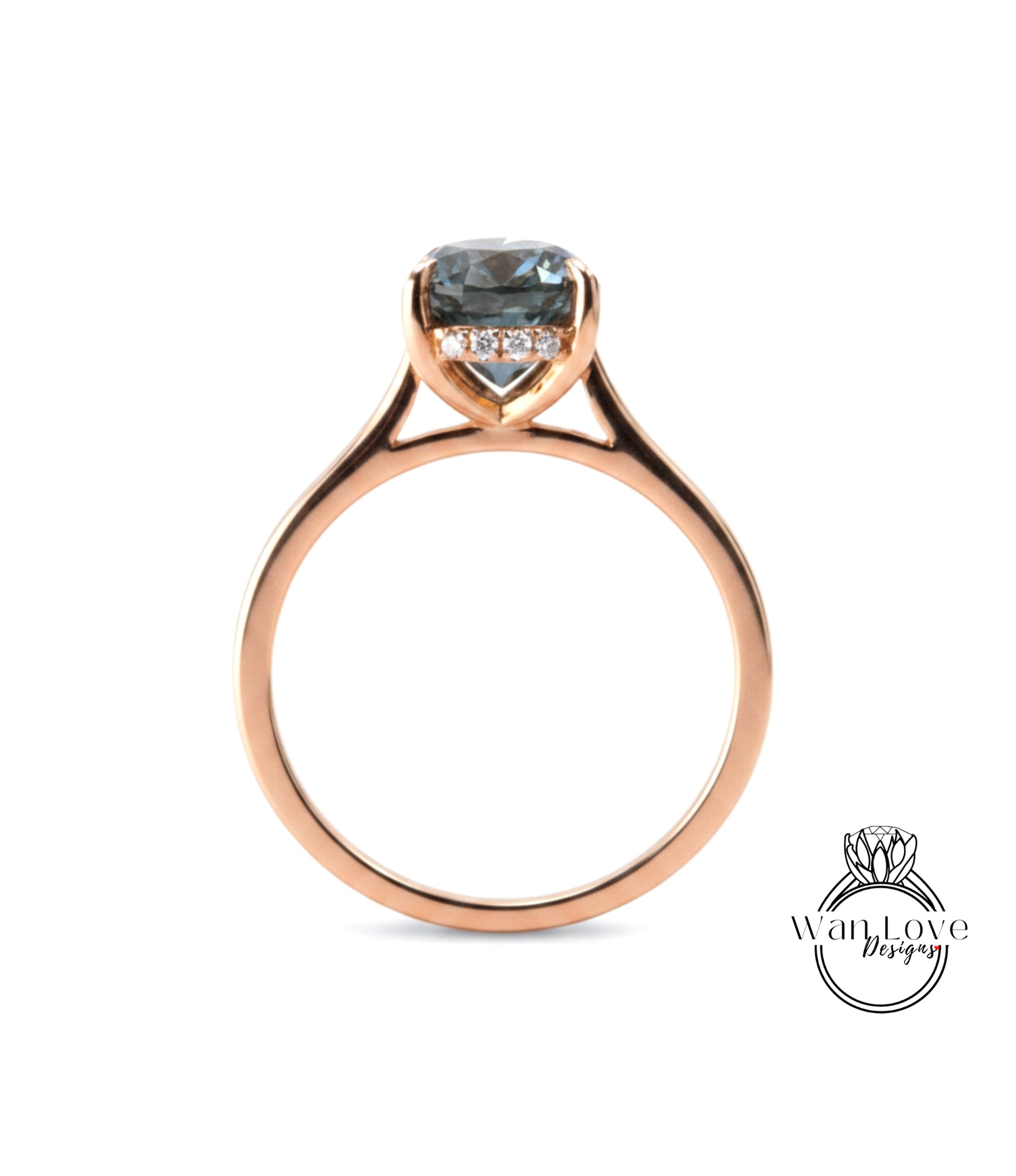 A rose gold engagement ring with a large blue gemstone set in the center.