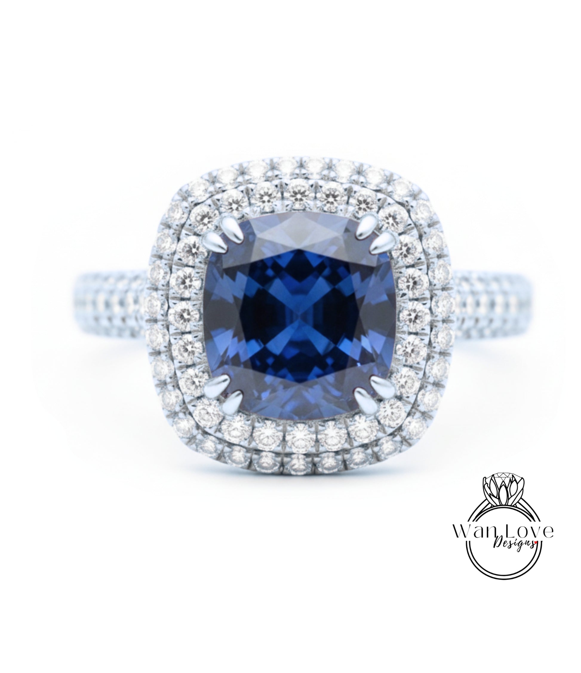 A stunning diamond engagement ring with a large blue gemstone set in a halo of smaller diamonds, surrounded by a sparkling bezel of diamonds.
