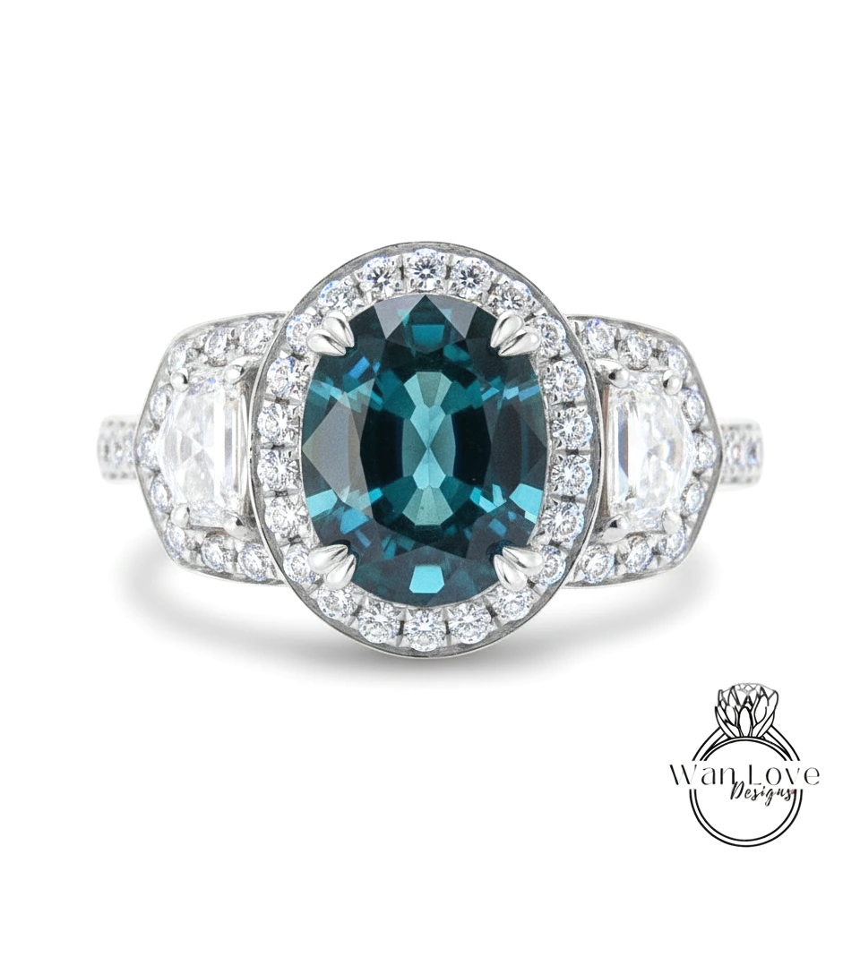 A stunning engagement ring with a large oval-shaped blue gemstone surrounded by a halo of smaller diamonds, set in a silver band.