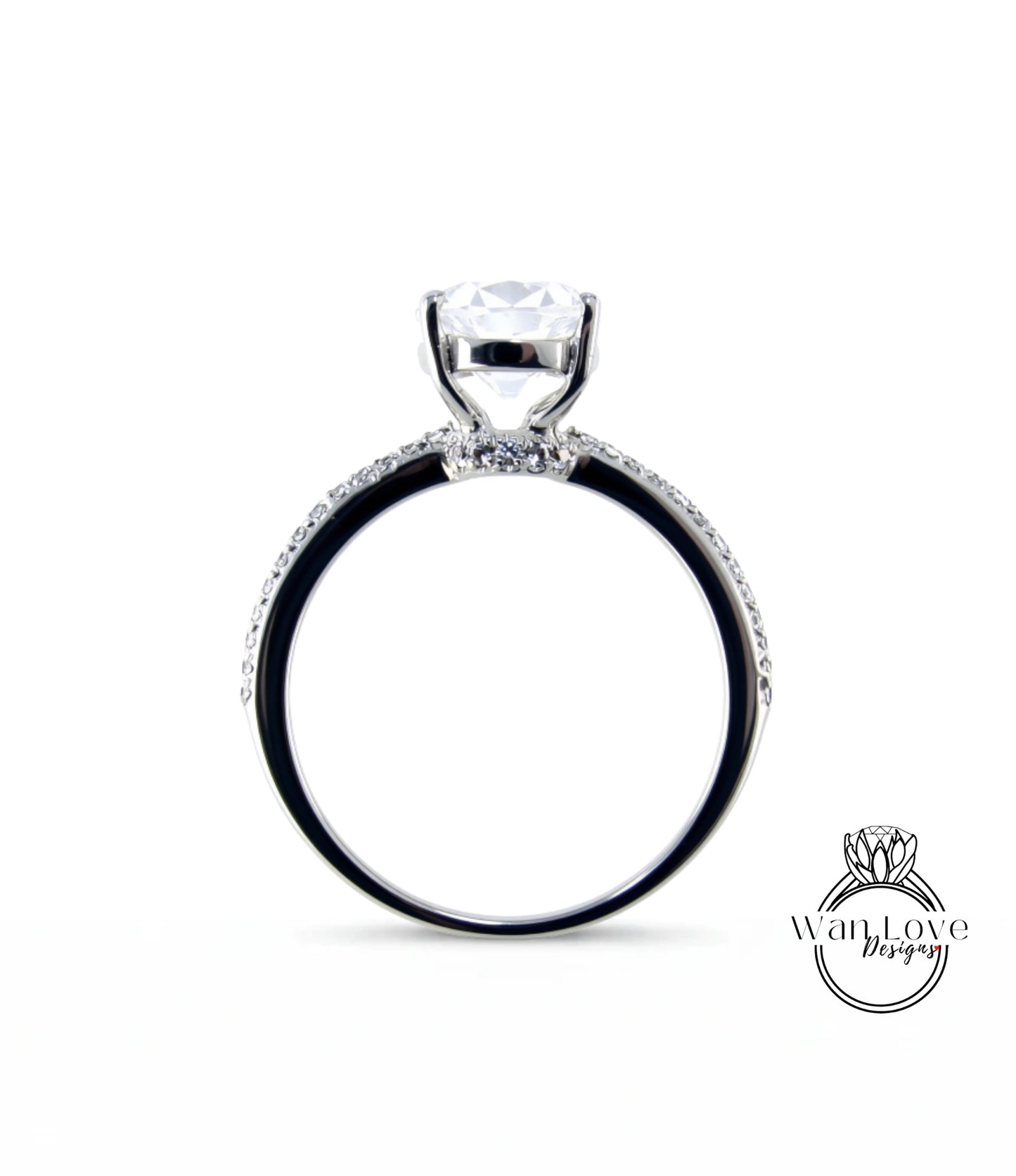 A silver engagement ring with a large central diamond and a halo of smaller diamonds around the band.