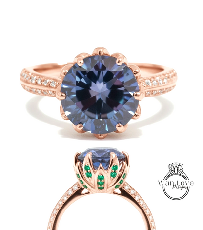 a beautiful rose gold ring with a large blue gemstone at the center, surrounded by smaller diamonds. The ring has a delicate floral design and is adorned with green gemstones.