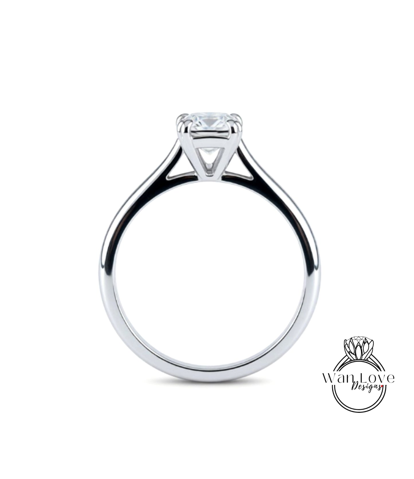A silver engagement ring with a large diamond set in the center.