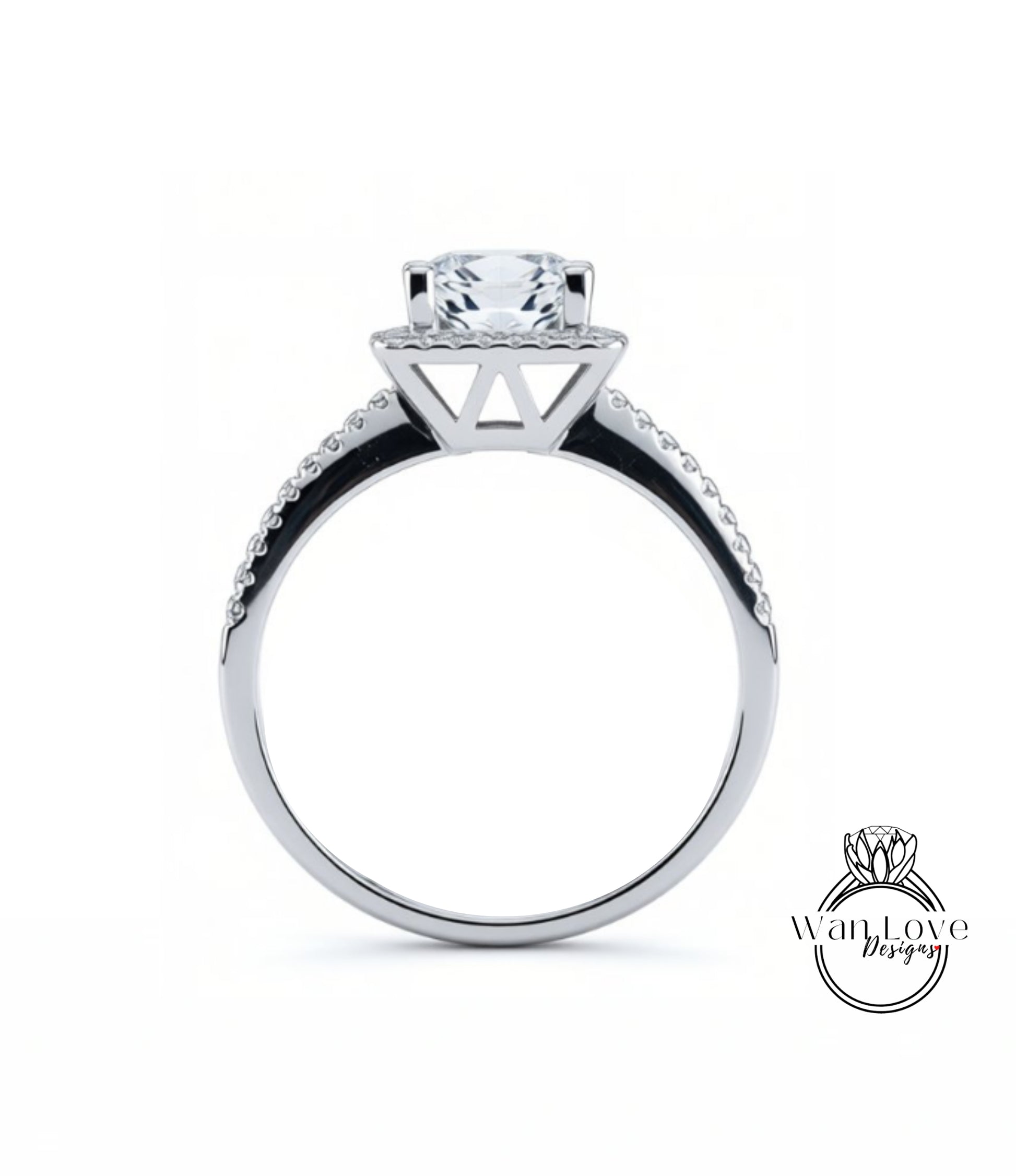 A silver engagement ring with a large central diamond and a halo of smaller diamonds around the top.