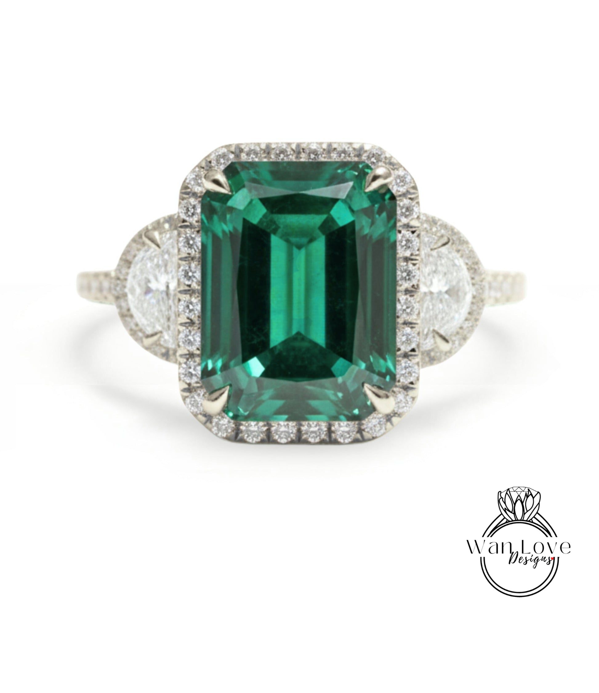 A large, green gemstone ring with a halo of smaller diamonds around the center stone.