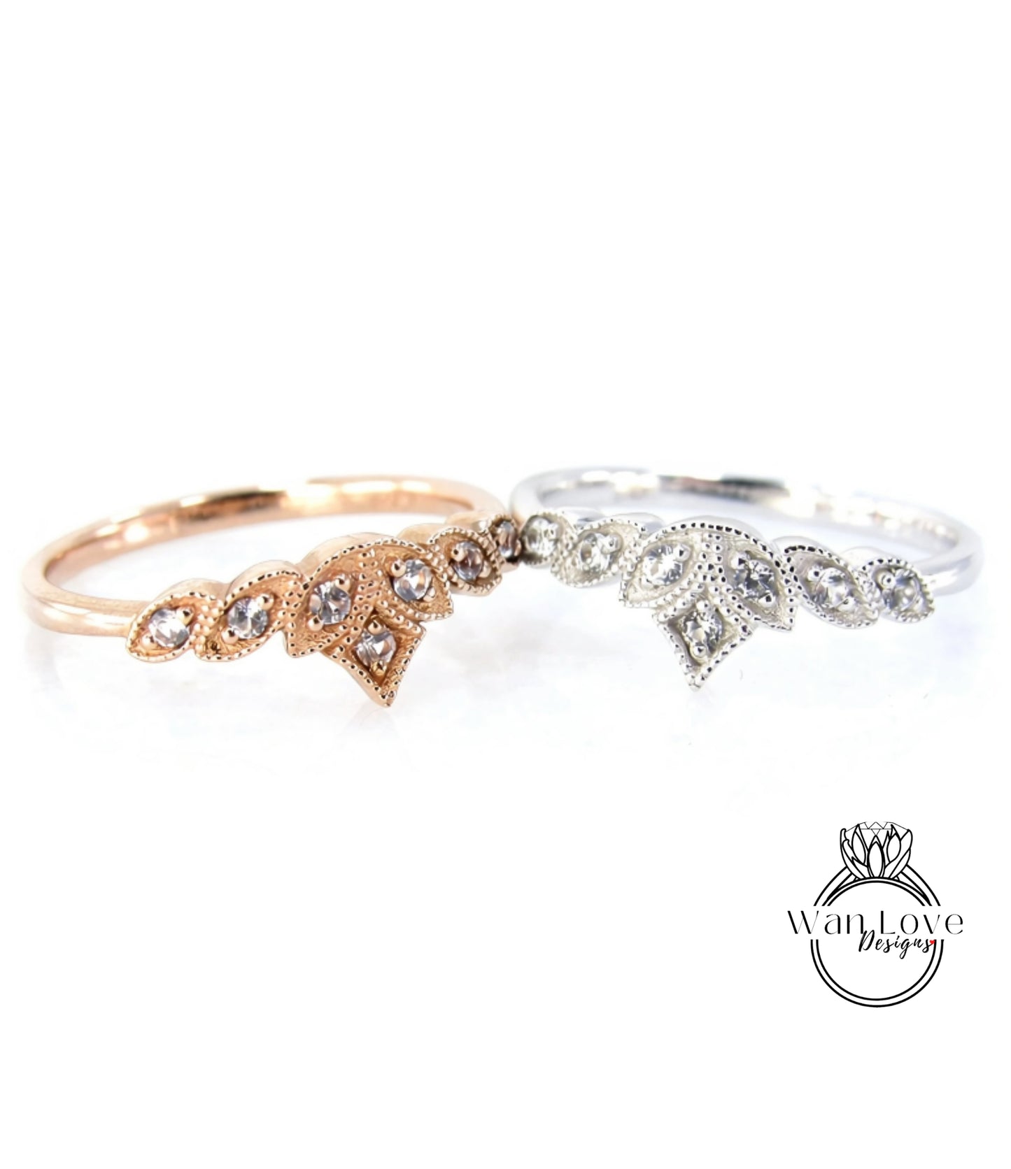 Two rings with gemstone designs are displayed against a white background.