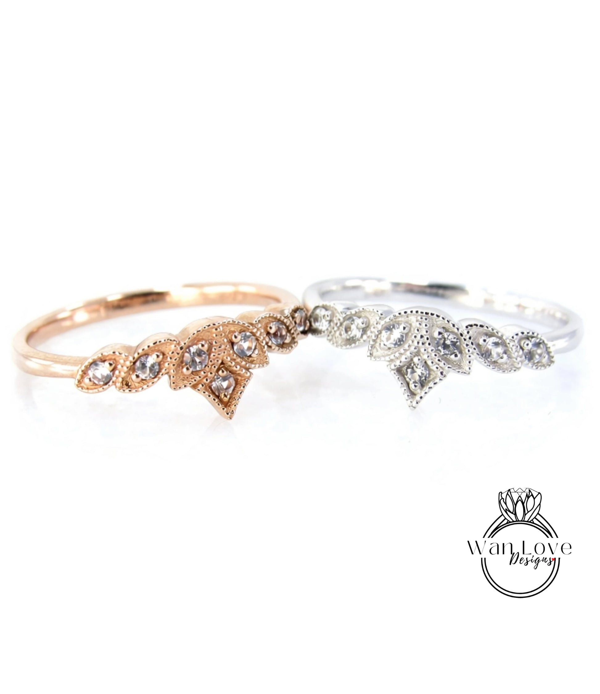 Two rings with gemstone designs are displayed against a white background.