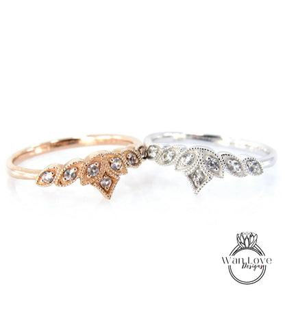 Two rings with gemstone designs are displayed against a white background.