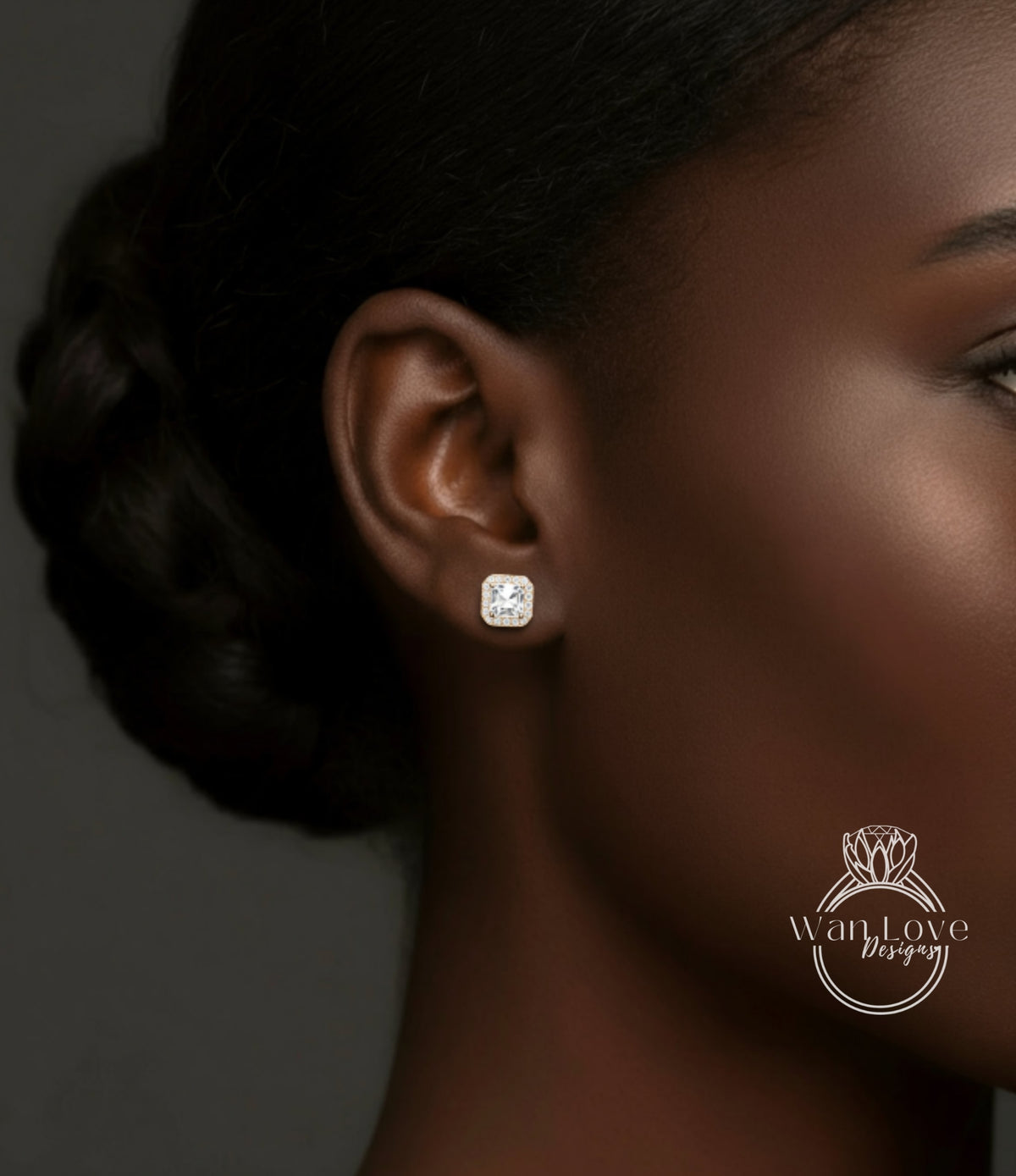 A close-up of a woman's ear with a diamond earring featuring a large, clear gemstone.