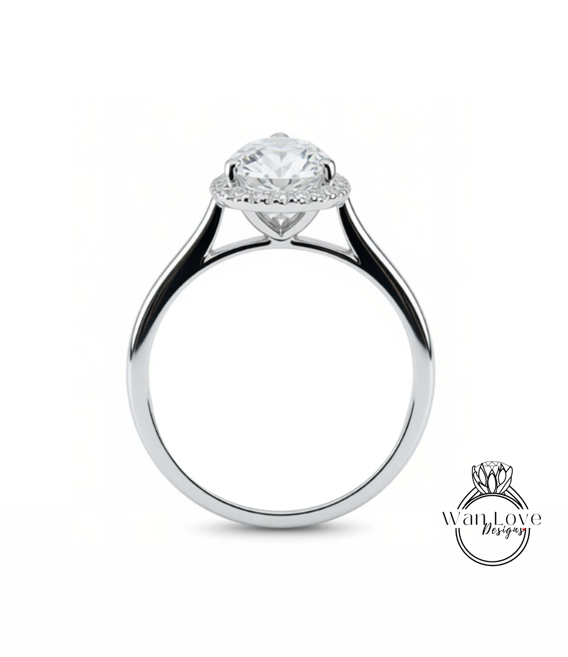 A close-up view of a silver engagement ring with a large, round diamond at the center, surrounded by a halo of smaller diamonds.