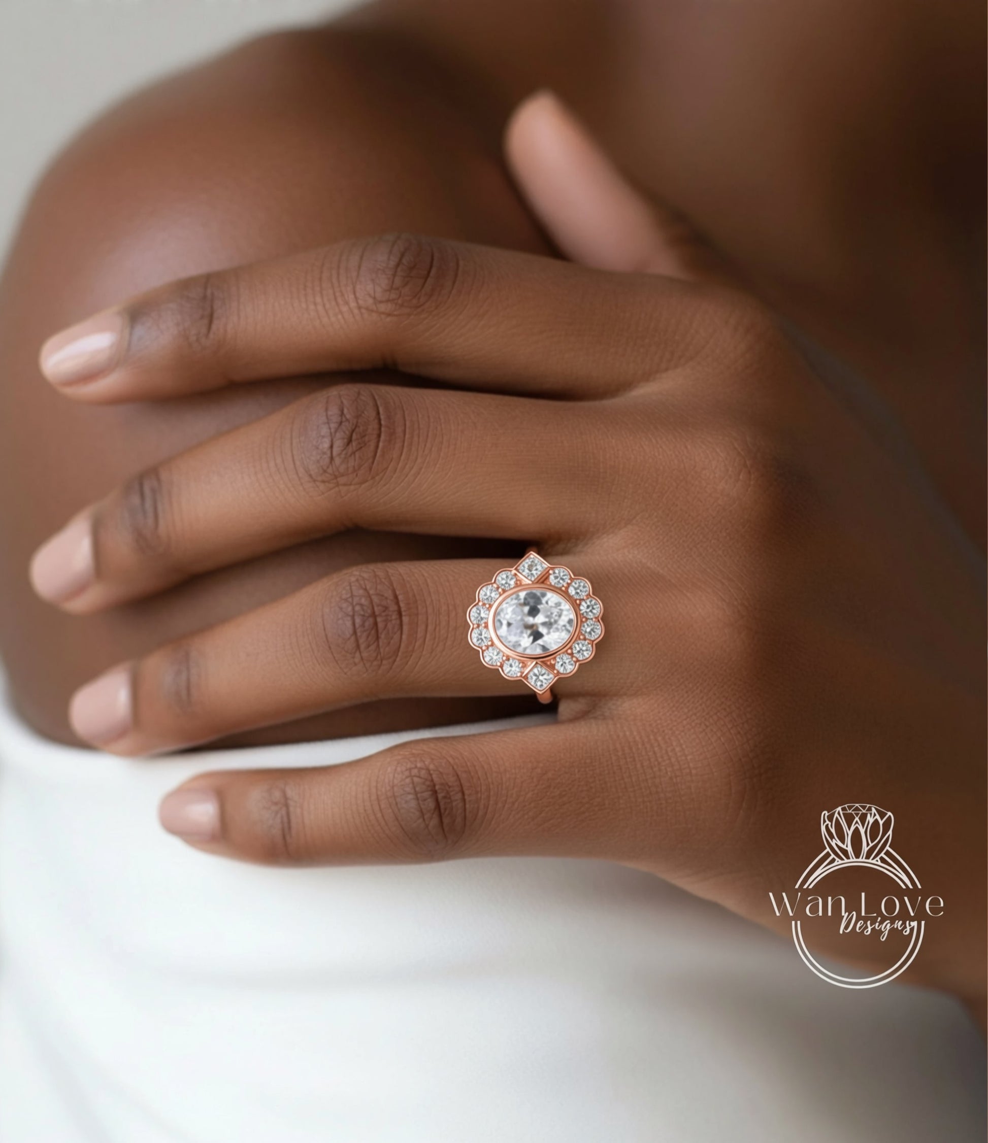 A close-up of a person's hand wearing a large, ornate diamond ring.