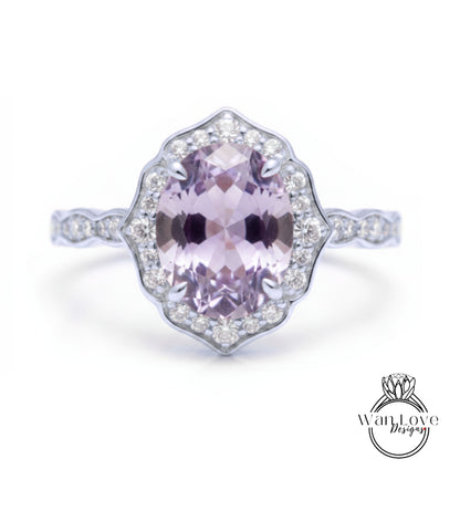 A beautiful ring featuring a large oval-shaped gemstone surrounded by a halo of smaller diamonds.