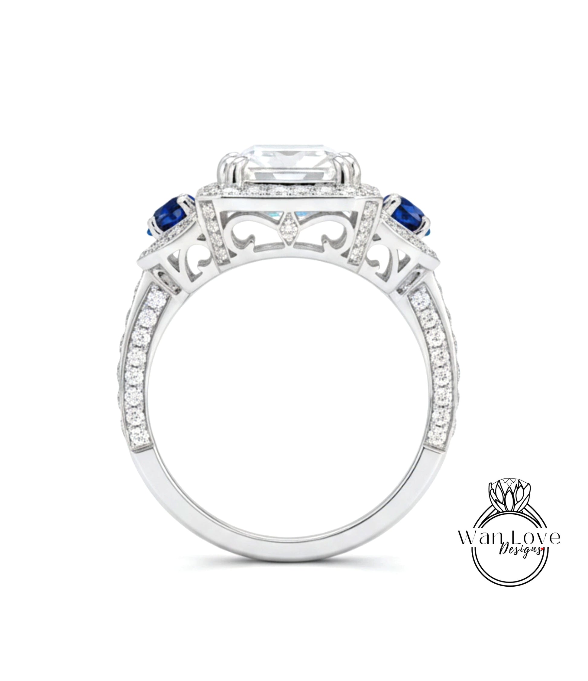 A silver ring with a large central gemstone surrounded by smaller gemstones and a halo of smaller diamonds.