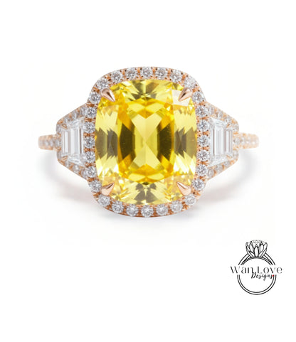 A large yellow gemstone ring with a halo of smaller diamonds around the center stone.