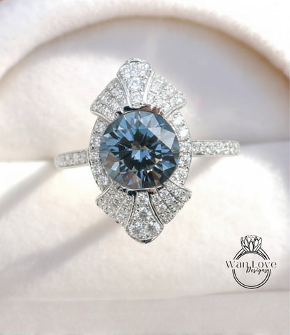 A close-up image of a diamond engagement ring with a large blue gemstone set in a silver band.