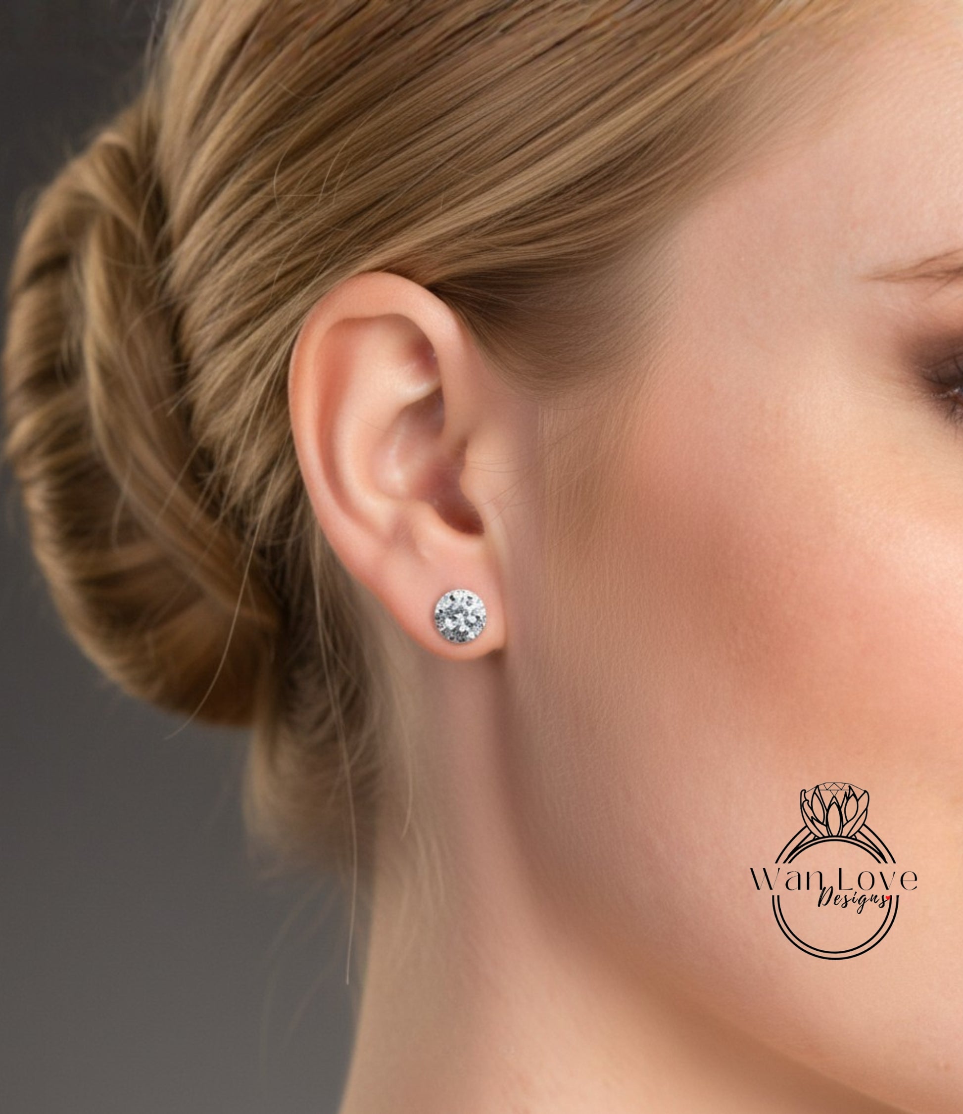 A close-up of a woman's ear with a diamond earring, showcasing the earring and the woman's face.