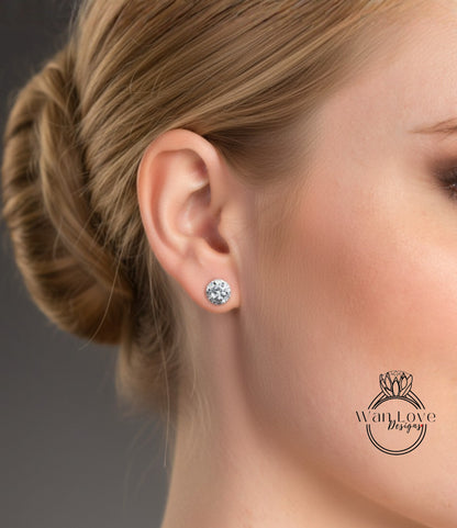 A close-up of a woman's ear with a diamond earring, showcasing the earring and the woman's face.