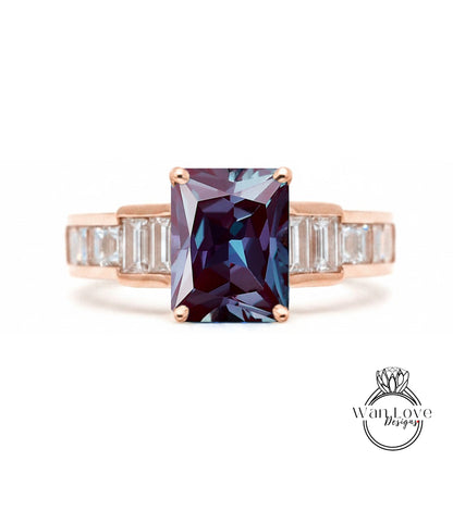 a ring with a large, dark purple gemstone set in a rose gold band.