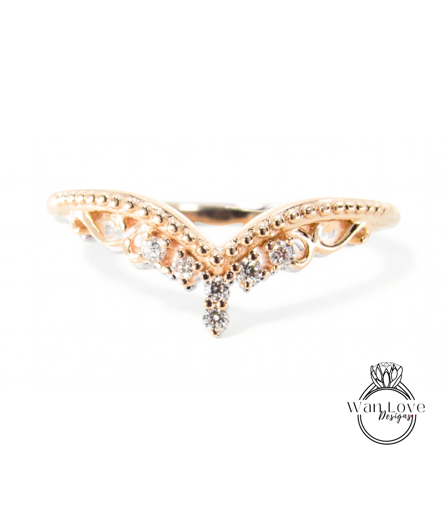 A gold ring with a decorative design featuring a central diamond and smaller diamonds surrounding it.