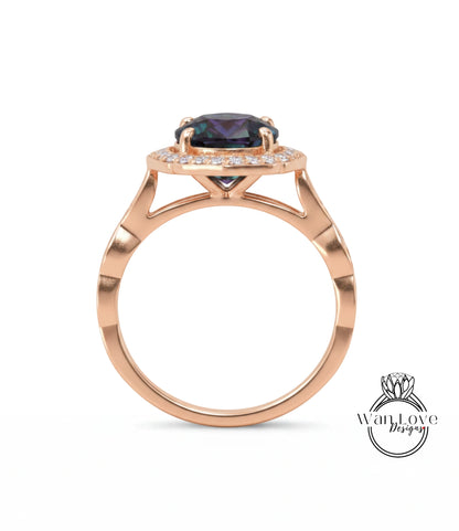 A gold ring with a large purple gemstone set in the center, surrounded by smaller diamonds.