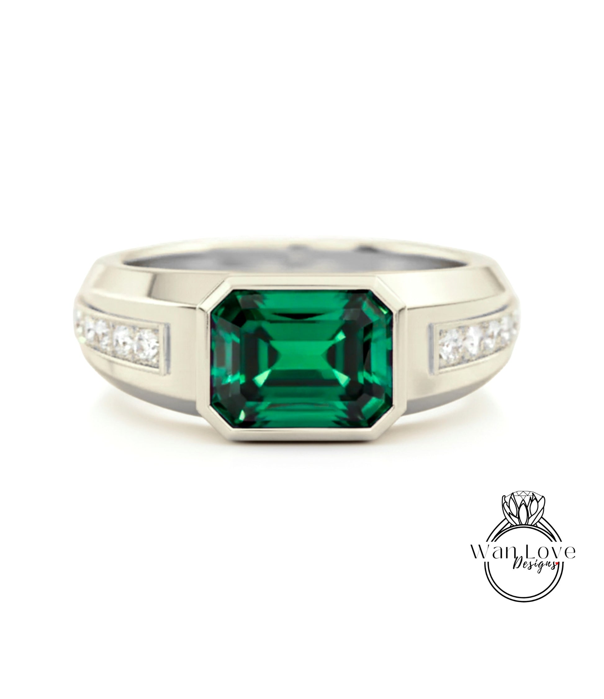 A silver ring with a large, green gemstone in the center.