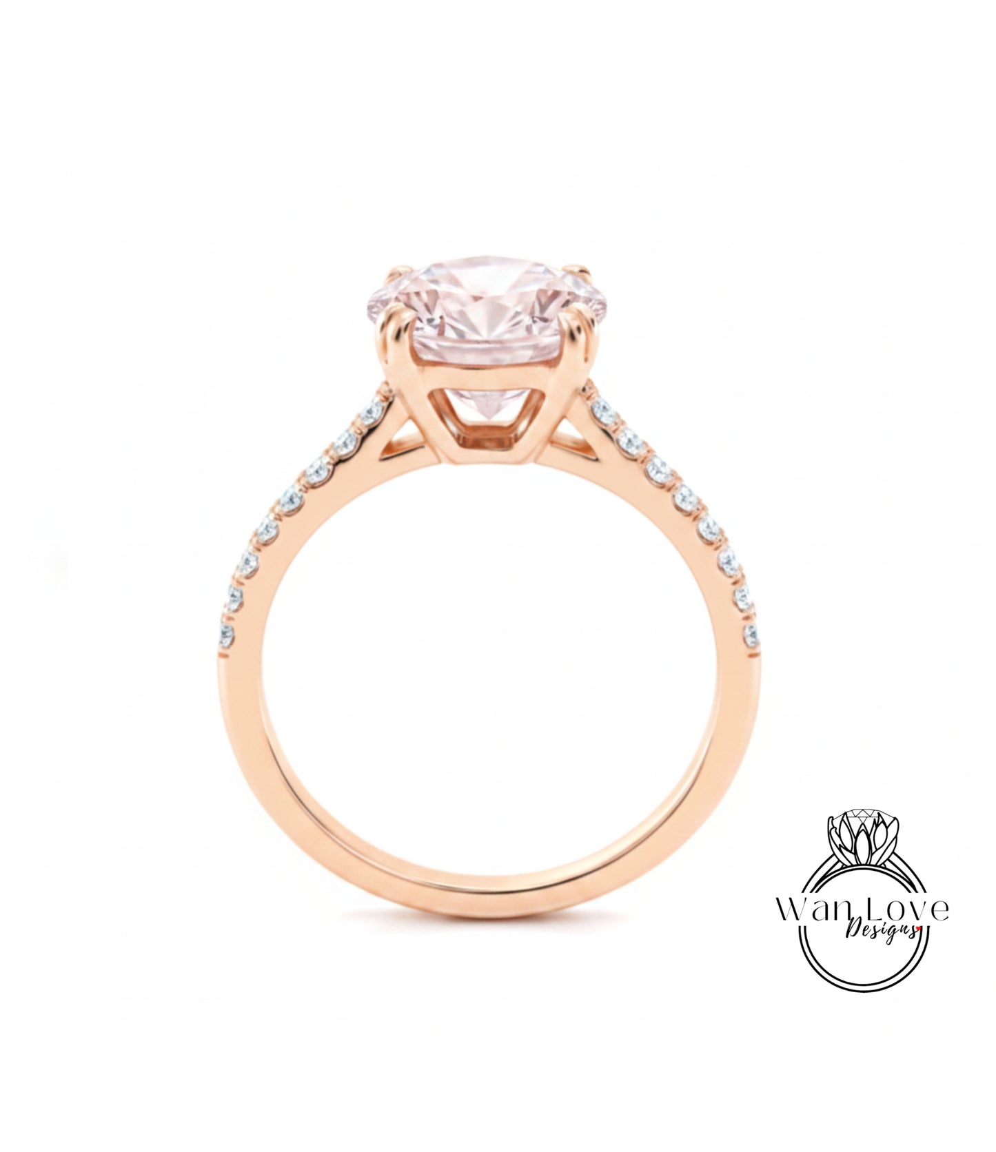 A gold engagement ring with a large pink diamond set in the center, surrounded by smaller diamonds along the band.