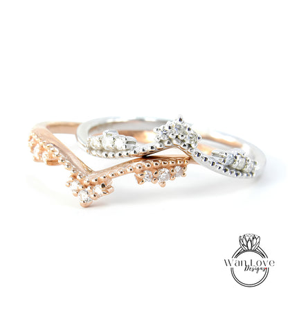 A close-up image of three rings with diamond-encrusted designs, showcasing the intricate details and craftsmanship of the jewelry.