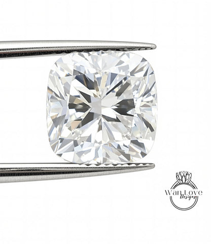 A large, clear diamond is being held between two metal tongs, showcasing its brilliant sparkle.