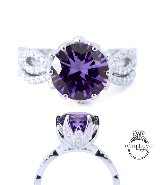 a stunning purple gemstone ring with a large central purple gemstone surrounded by smaller diamonds set in a silver band.