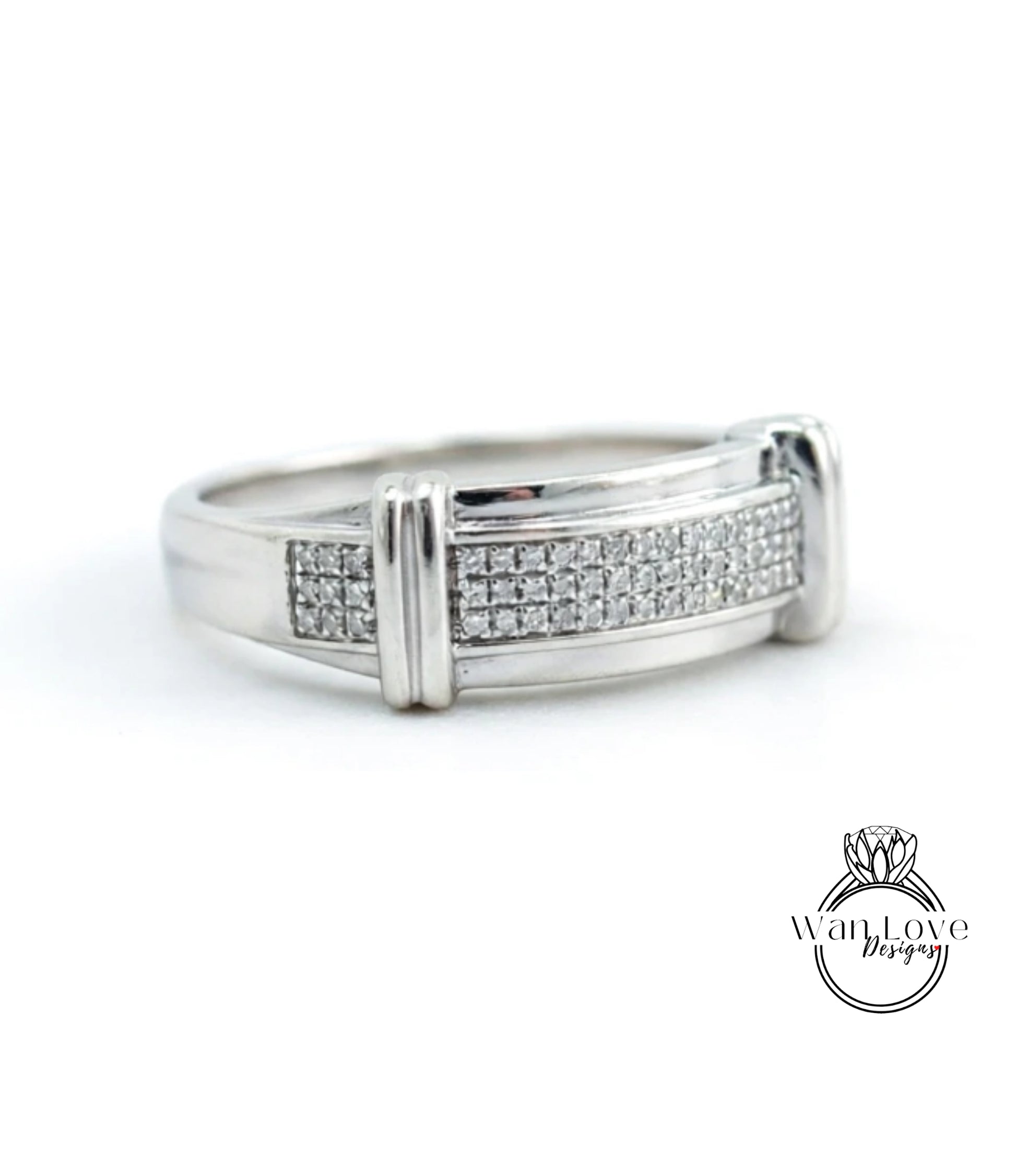 A silver ring with a row of small diamonds set in the band.