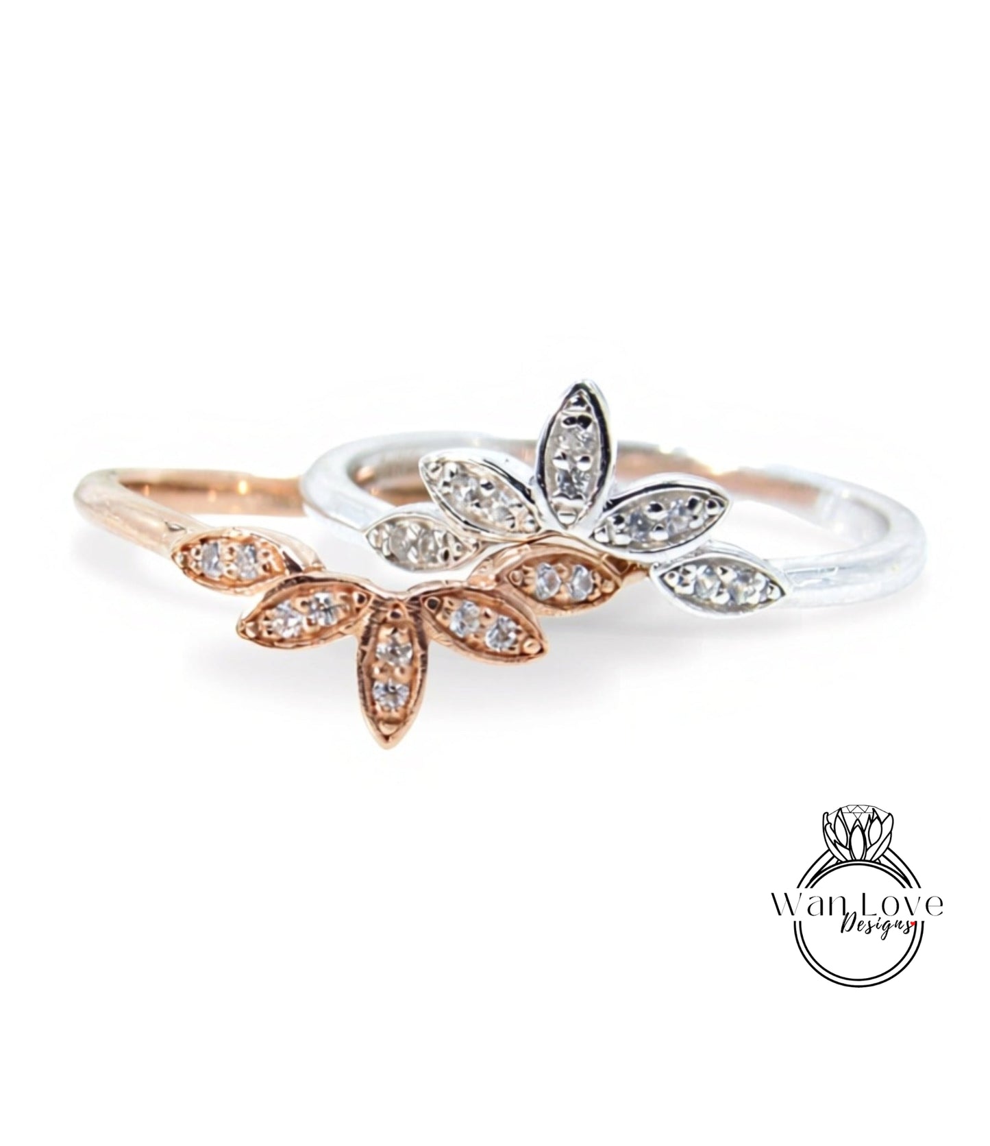two rings with flower-shaped gemstones on them.