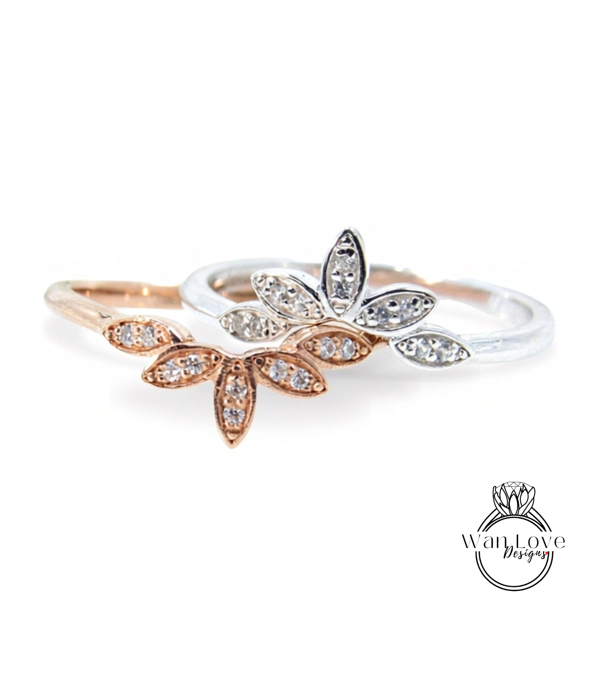 two rings with flower-shaped gemstones on them.