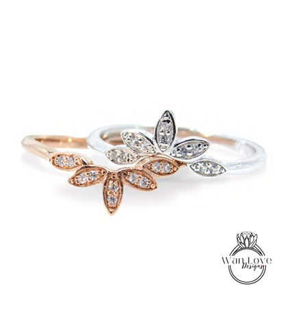 two rings with flower-shaped gemstones on them.