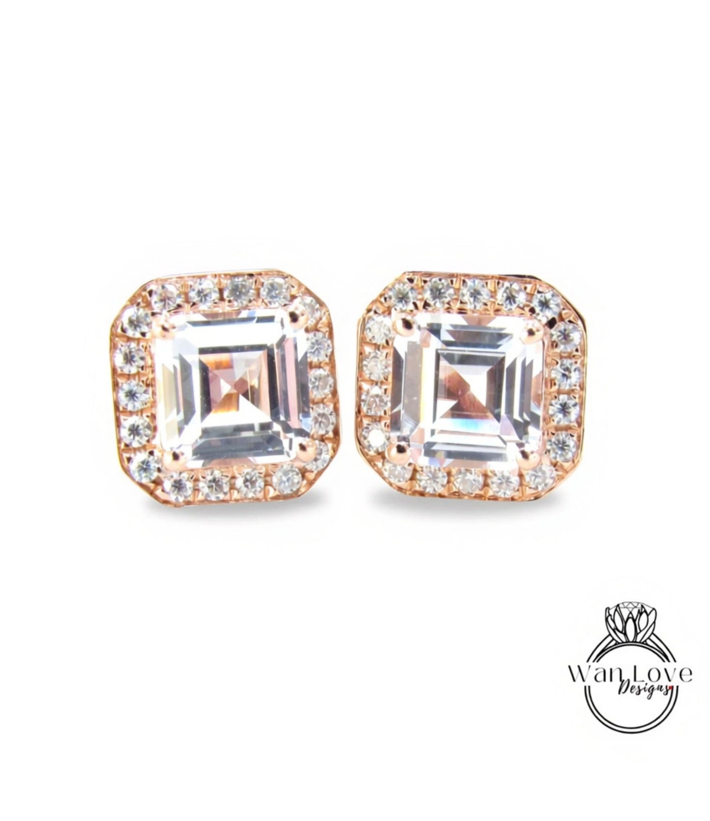 A pair of elegant earrings with large, clear gemstones set in a gold-toned metal frame.