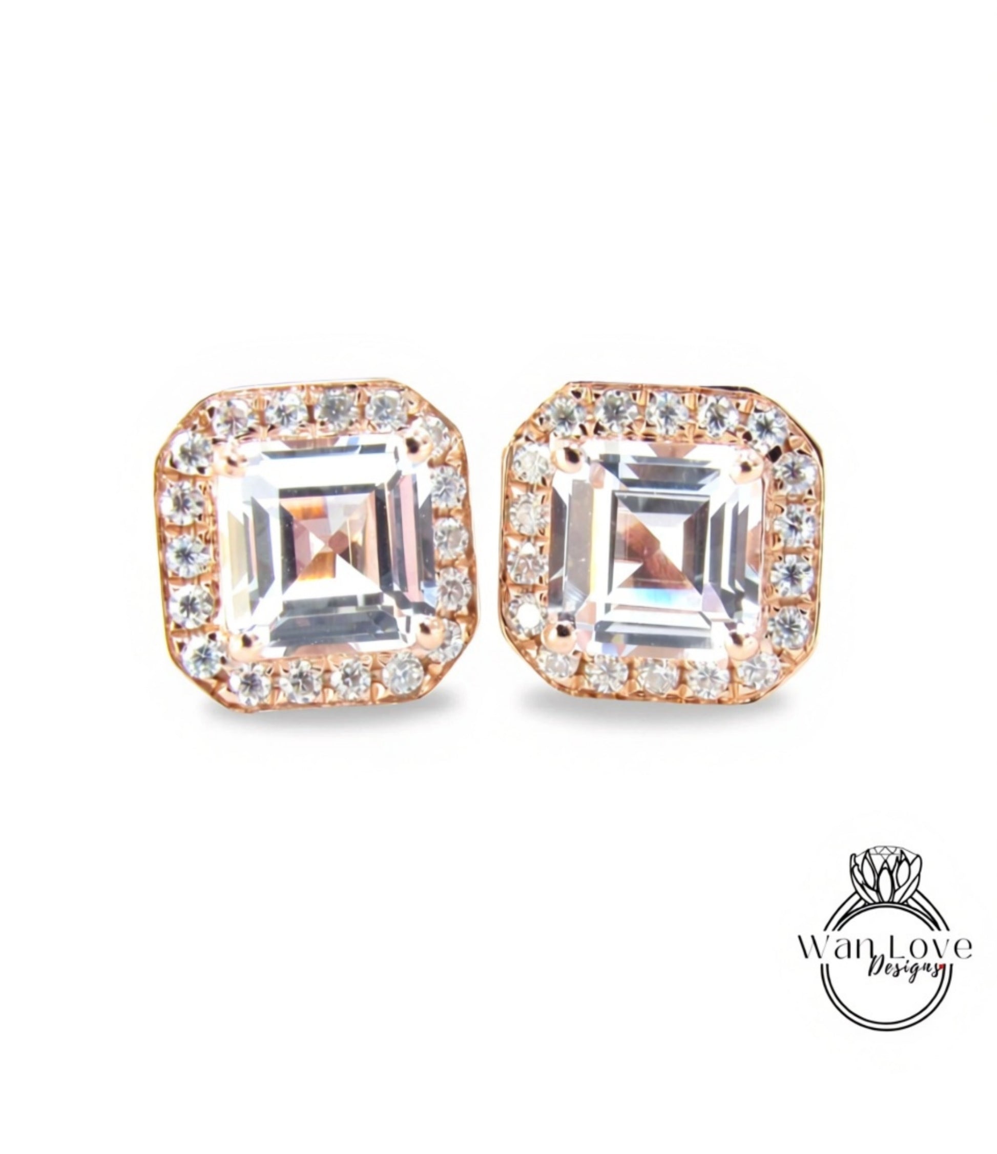 A pair of elegant earrings with large, clear gemstones set in a gold-toned metal frame.