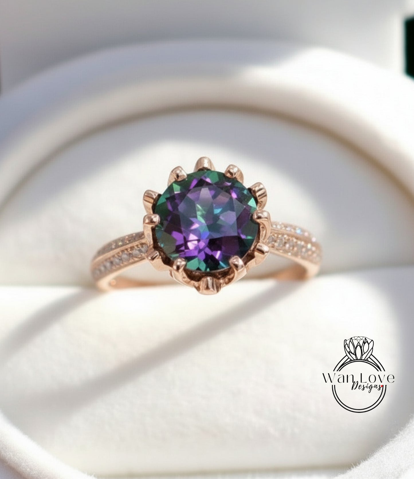 A close-up image of a gold ring with a large, colorful gemstone, likely a diamond, set in the center of the band.