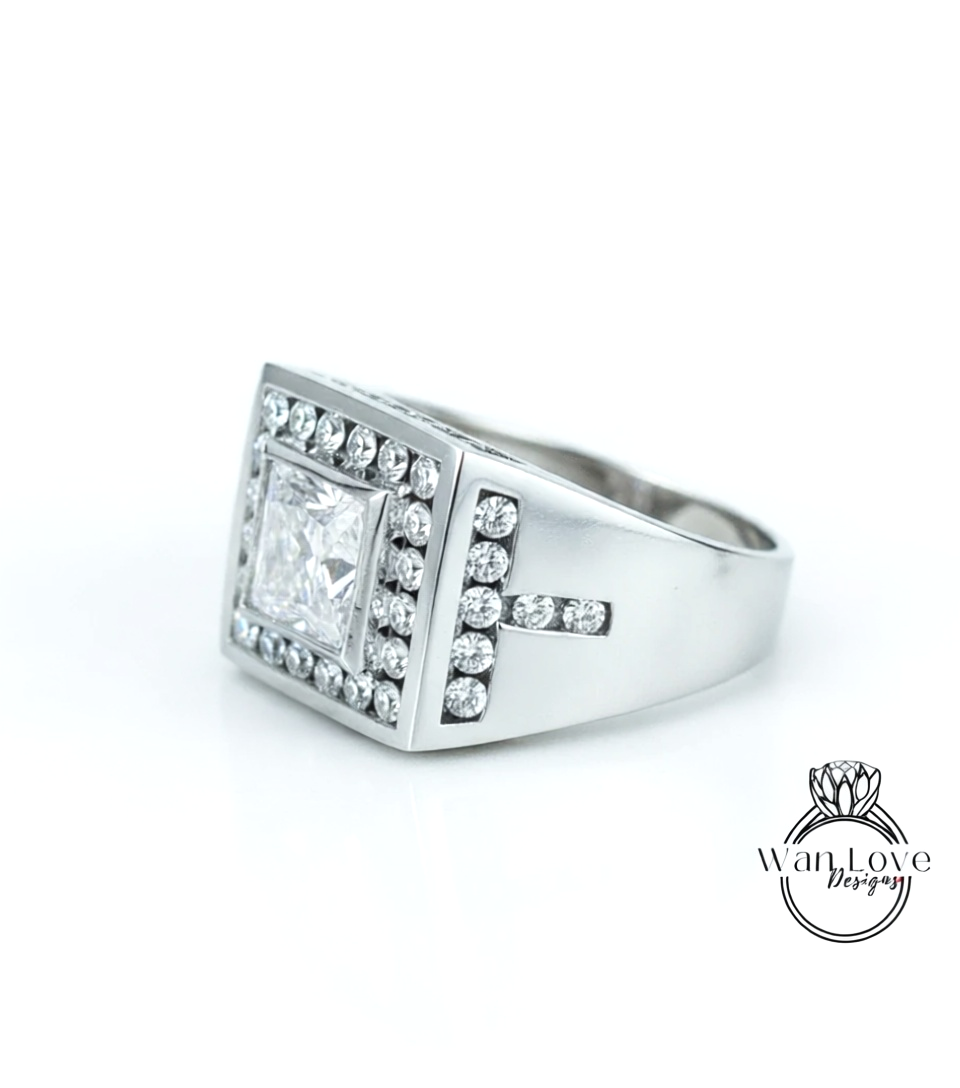 A silver ring with a large diamond in the center, surrounded by smaller diamonds, and a cross-shaped accent on the side.