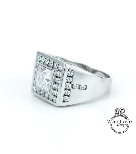 A silver ring with a large diamond in the center, surrounded by smaller diamonds, and a cross-shaped accent on the side.