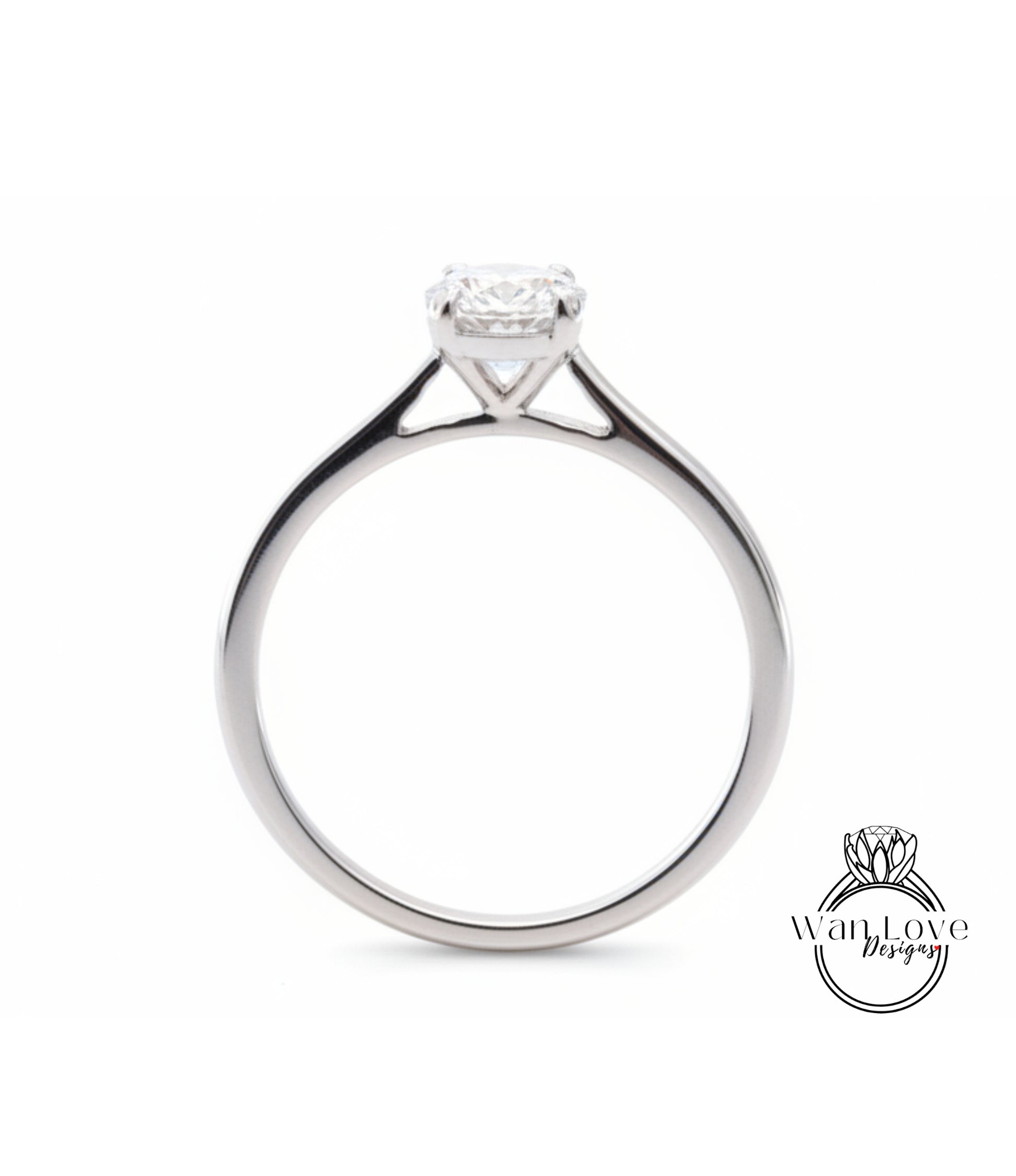 A silver engagement ring with a large diamond set in the center of the band.