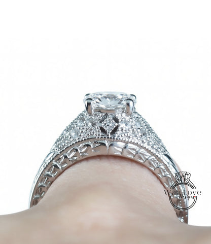 A close-up view of a diamond engagement ring on a person's hand, showcasing the intricate design and sparkling gemstone.