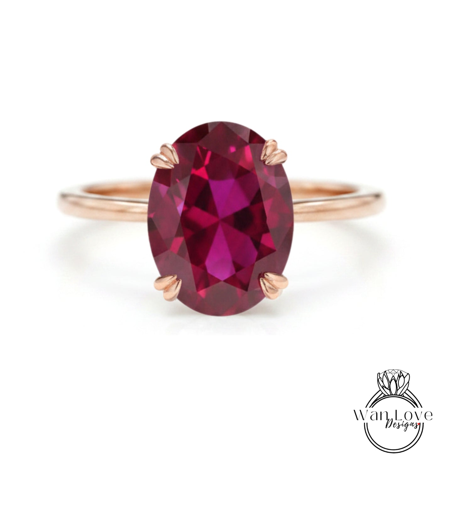 A rose gold ring with a large oval-shaped garnet gemstone set in the center.
