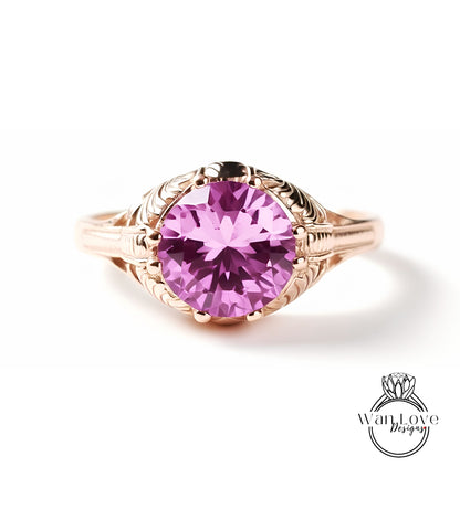 A gold ring with a large, round purple gemstone set in the center.