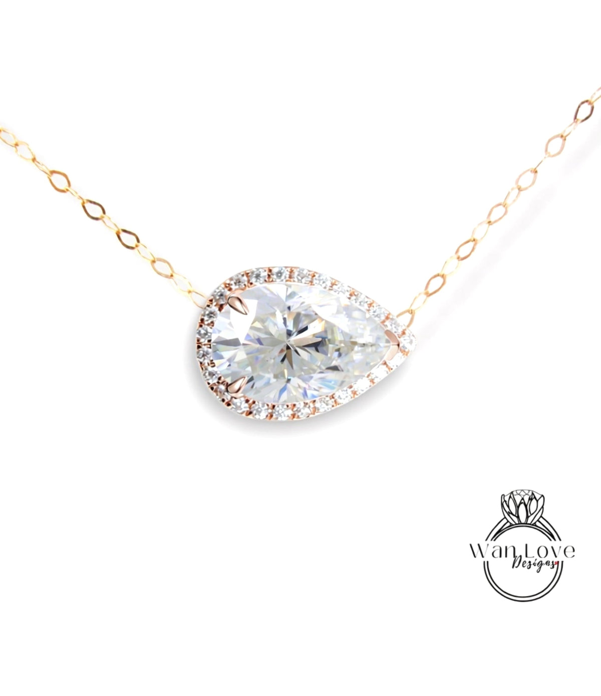 A necklace with a large, clear diamond pendant set in a gold-toned metal frame.