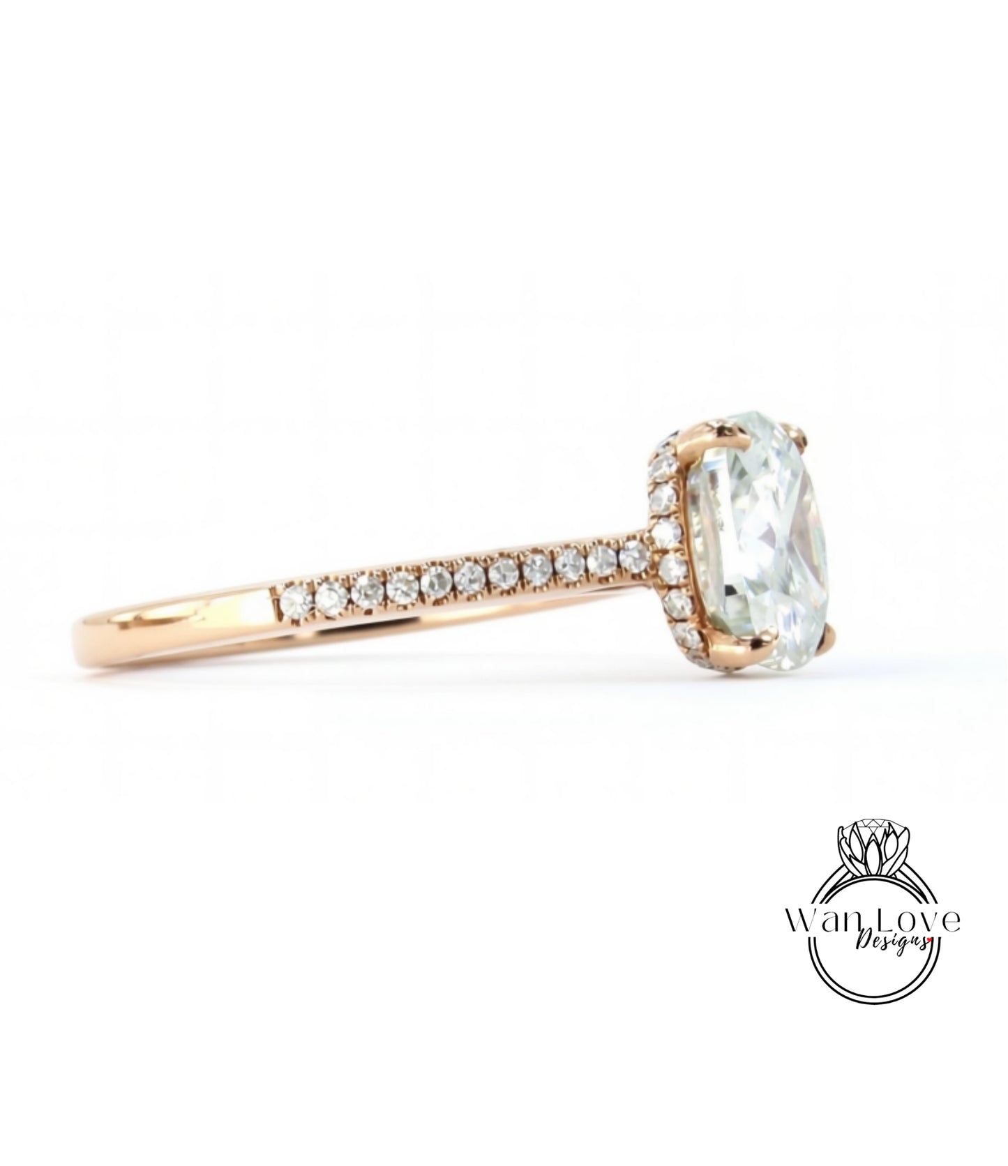 A gold ring with a large oval-shaped gemstone, possibly a diamond, set in the center.